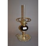 19th Century plated chamber candlestick converted to an oil lamp with a cranberry glass well