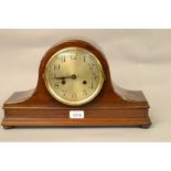 20th Century mahogany dome topped mantel clock having silvered dial with Arabic numerals and two