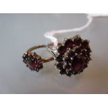 Two garnet set dress rings