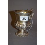 Victorian silver Christening mug of embossed baluster form with scroll handle,