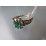 Modern 9ct yellow gold emerald and diamond ring,