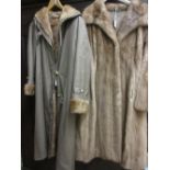 Ladies mid brown three quarter length fur coat together with a three quarter length fur lined coat