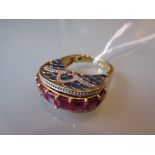 Silver gilt enamel and treated ruby dress ring