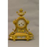 19th Century French ormolu and alabaster mantel clock with an urn surmount and mask head sides on a