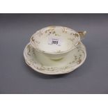 19th Century Rockingham teacup and saucer decorated with floral gilding