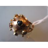 Continental yellow metal ball form ring set with various precious and semi precious cabochon stones