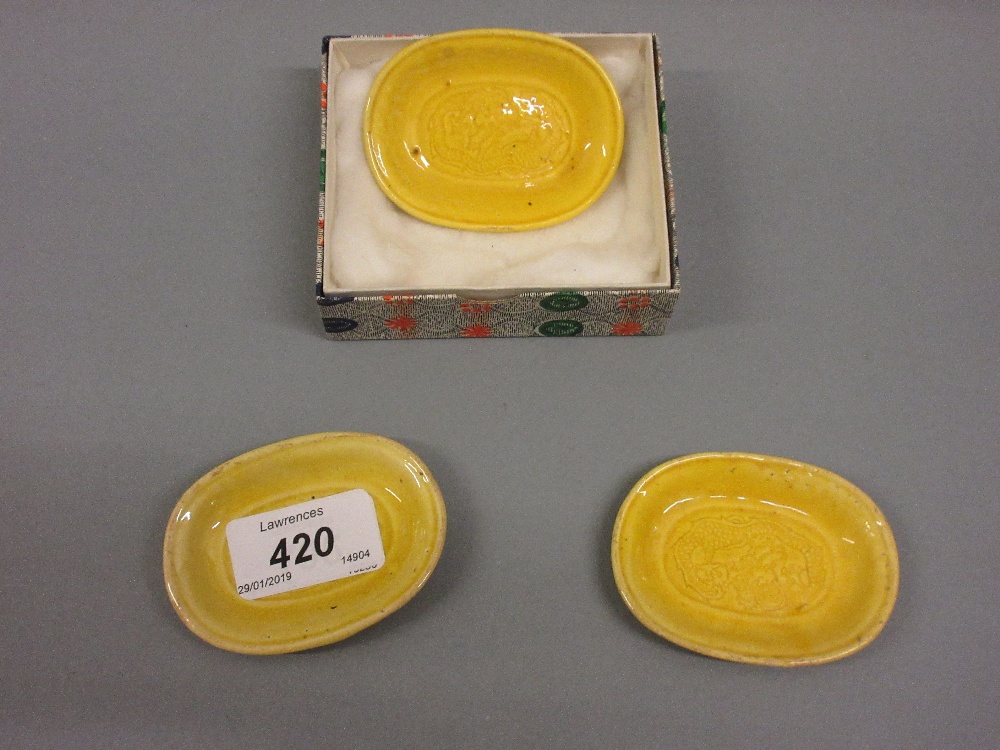 Group of three miniature Chinese yellow glazed dishes with incised decoration, 2.