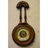 Late Victorian carved walnut aneroid barometer