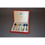 Cased set of six Danish silver and coloured enamel coffee spoons (one at fault)