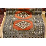 Pakistan rug of Turkoman design with rust ground