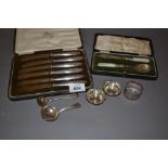 Cased set of six silver handed tea knives, silver caddy spoon, pair of salts,