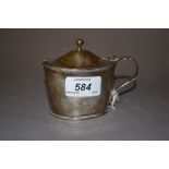 George III silver mustard of plain oval form with loop handle,