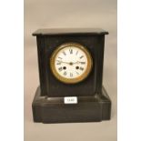 Small black slate two train mantel clock with pendulum