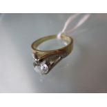 Small 18ct yellow gold solitaire diamond ring with raised setting