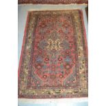 Small Hamadan rug with medallion and all-over Herati design on a rose ground with borders