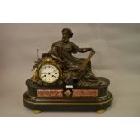 Bronze and coloured marble two train figural mantel clock,