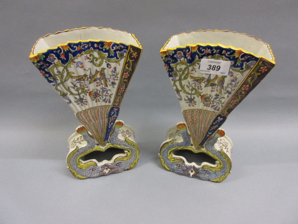 Pair of French Rouen pottery fan shaped vases on fish supports