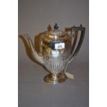 Victorian silver coffee pot of oval half fluted pedestal design with ebonised handle,