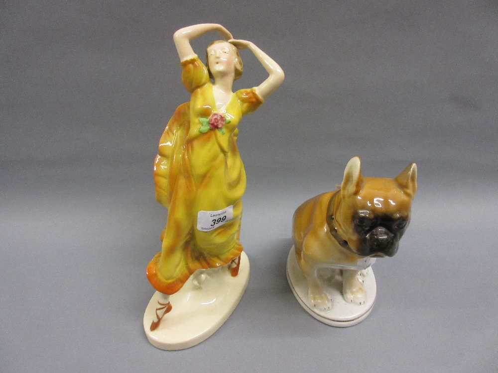 Czechoslovakian pottery figure of a girl dancer together with a Russian figure of a seated dog