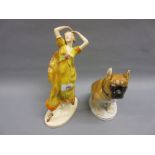 Czechoslovakian pottery figure of a girl dancer together with a Russian figure of a seated dog