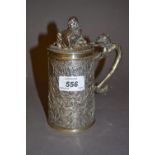 Chinese style silver plated lidded tankard decorated in high relief with various figures and horses,
