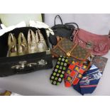 Case containing three various ladies handbags,