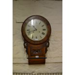 19th Century figured walnut circular drop-dial clock with Roman numerals and two train movement