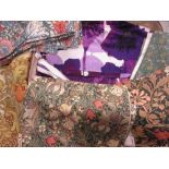 Suitcase containing a quantity of 1960's Heals Purple Pansies pattern curtains designed by Howard