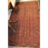 Tekke rug with multiple gol design on a red ground with borders