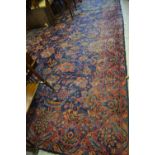 Meshed carpet having all-over floral design on a blue and burgundy ground with borders,