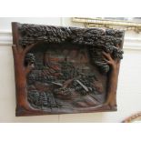 Black Forest large heavily carved plaque of a castle with eagle carrying a branch,