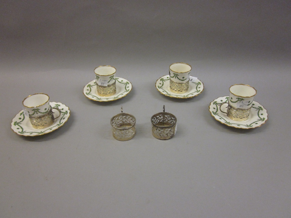 Part set of Aynsley coffee cups and saucers with silver holders comprising: six holders,