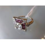 Platinum diamond and ruby ring with a central diamond of approximately 0.