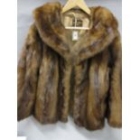 Ladies dark brown fur jacket together with a fur stole