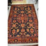 Two 20th Century Persian style rugs with all-over floral decoration CONDITION REPORT