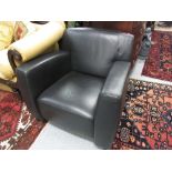 Pair of 20th Century black leather upholstered armchairs