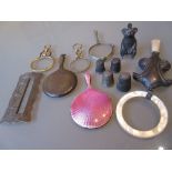 Two miniature silver hand mirrors together with various quizzing glasses etc.