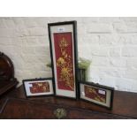 Group of three 20th Century Chinese gilt metal on silk relief work plaques in lacquer frames