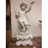 Large 19th Century German bisque figure of seated putto holding a lily on a separate rococo design