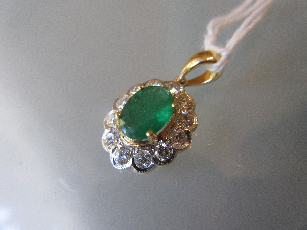 18ct Yellow gold emerald and diamond pendant, the emerald approximately 1.