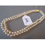 Double row uniform cultered pearl necklace with a 9ct gold clasp