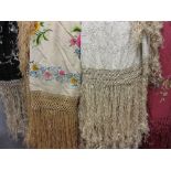 Group of four oriental silk and needlework floral decorated shawls