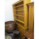 Modern light oak dresser with a boarded shelf back above three drawers and three cupboard doors