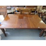 Victorian rectangular mahogany pull-out extending dining table with a single extra leaf raised on