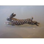 Diamond and ruby set running hare brooch