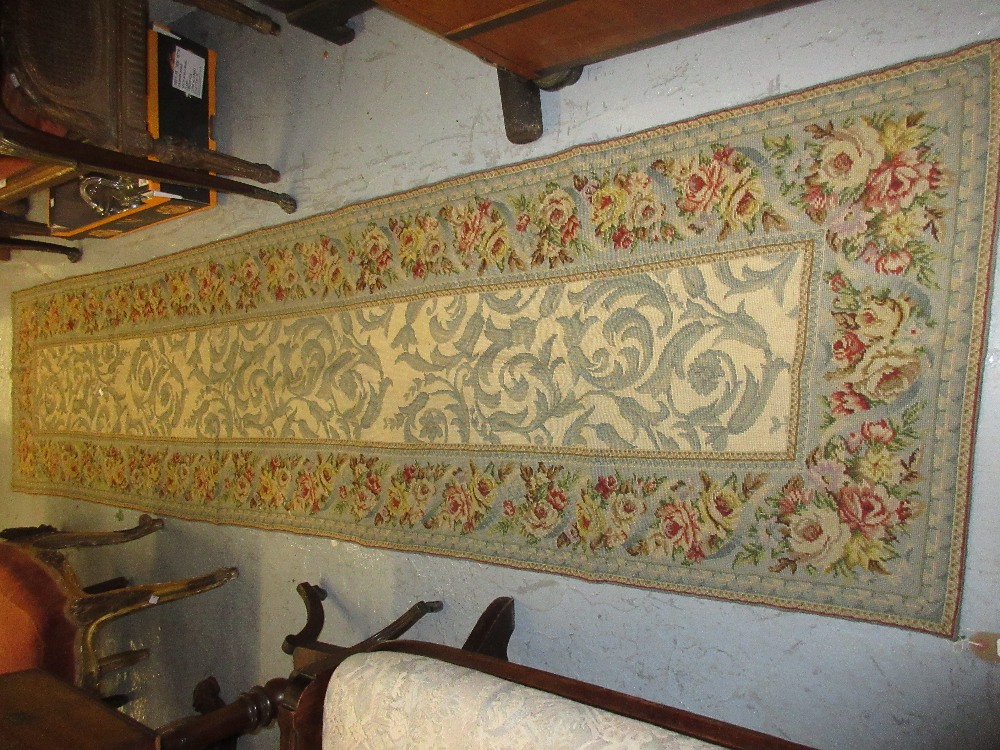 Aubusson style needlework runner with floral decoration on beige ground,