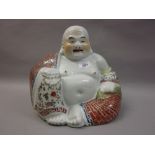 Early 20th Century Chinese porcelain enamel decorated figure of a seated Buddha,