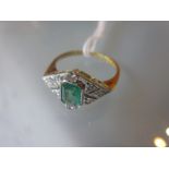 18ct Yellow gold ring set rectangular emerald and round brilliant cut diamonds