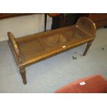 19th Century French carved giltwood window seat with cane panelled end handles and seat above a