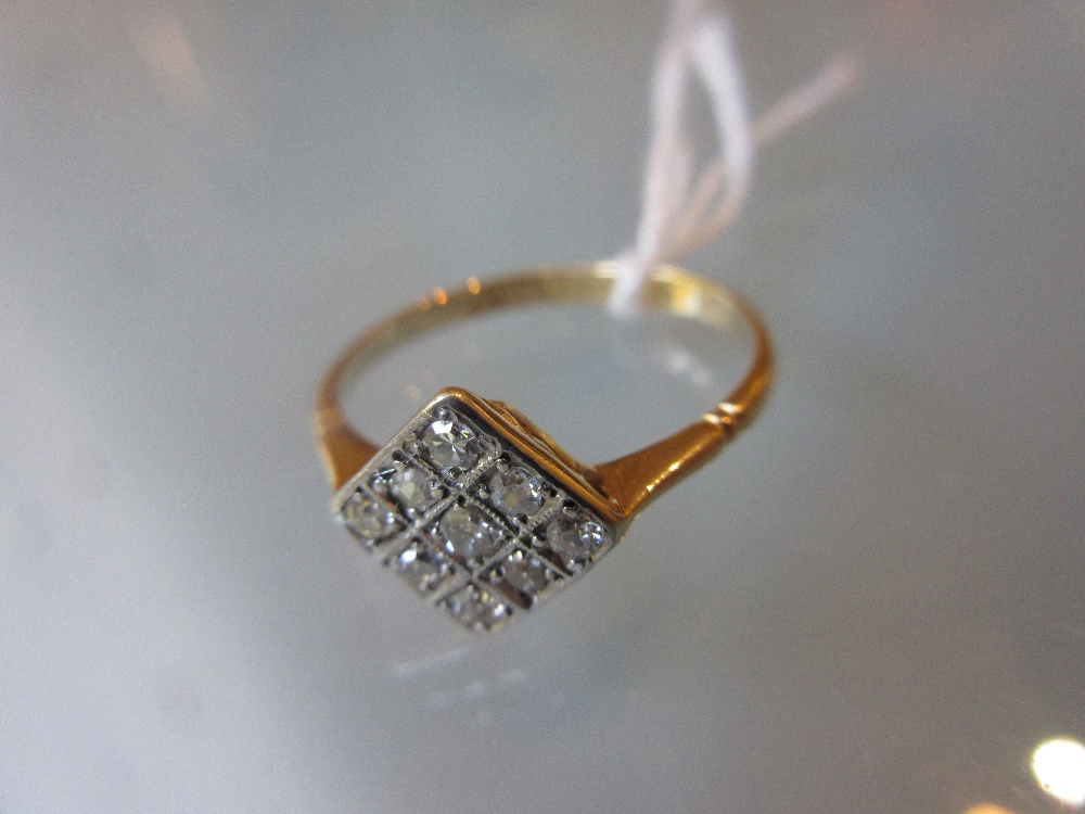 18ct Gold nine stone diamond set ring of square form CONDITION REPORT 2.2g.